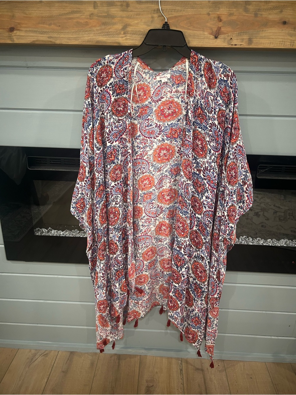 Paisley floral kimono cardigan with tassel hem.